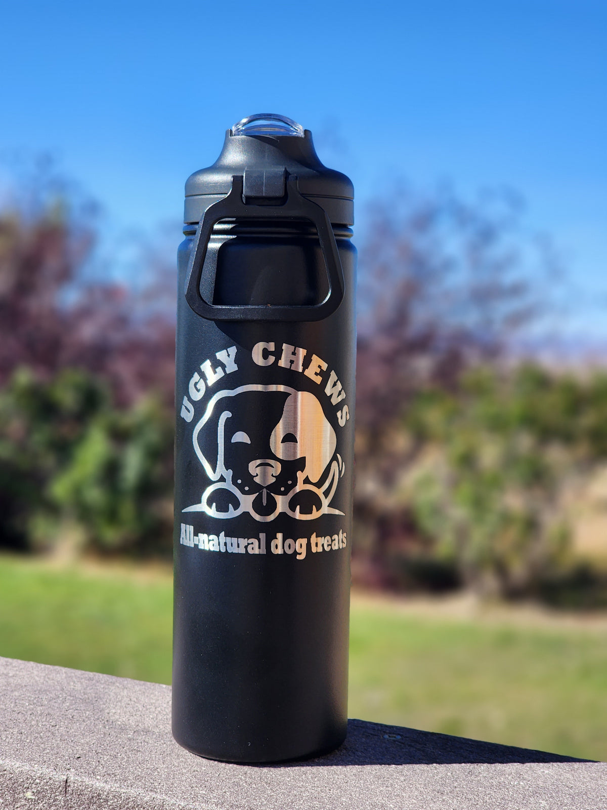 Black Ugly Chews insulated water bottle outdoors